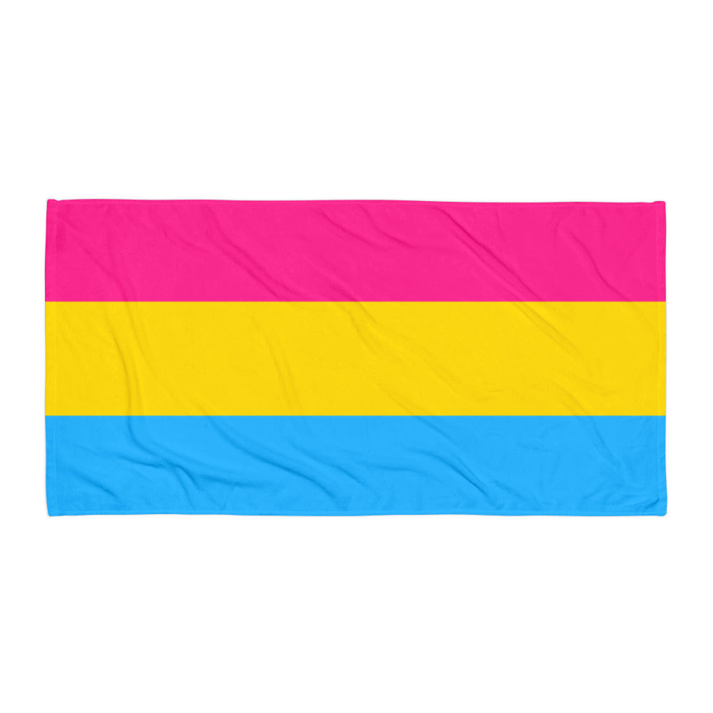 Rectangular towel laid flat, striped pink, yellow, and blue with slight wrinkles
