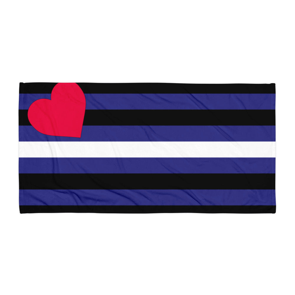 Flat-lay rectangular leather pride towel with black, blue, and white stripes and a red heart