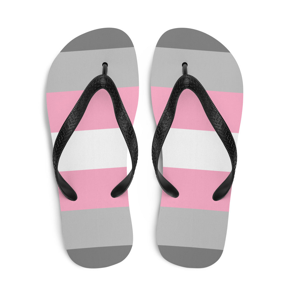 Pair of black-strap flip-flops with gray, white, and pink horizontal stripes