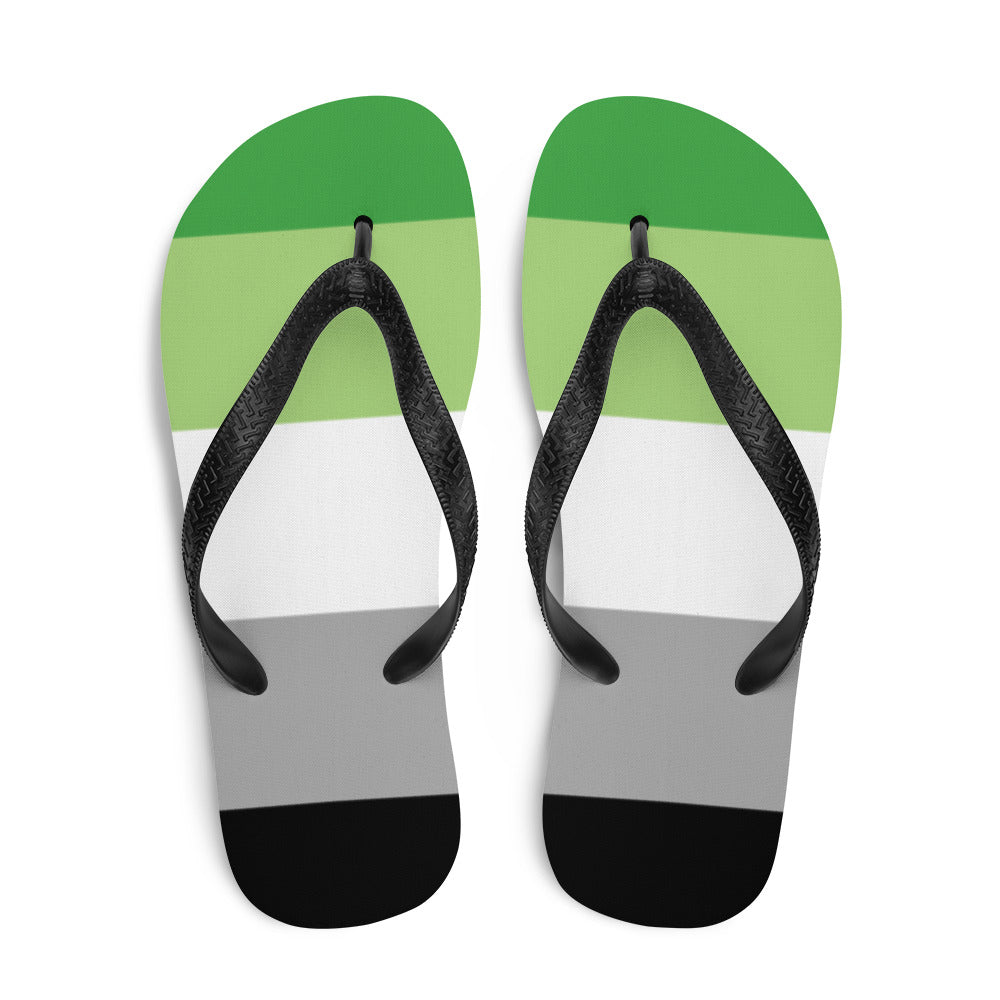 Pair of black-strap flip-flops with green, white, gray, and black stripes