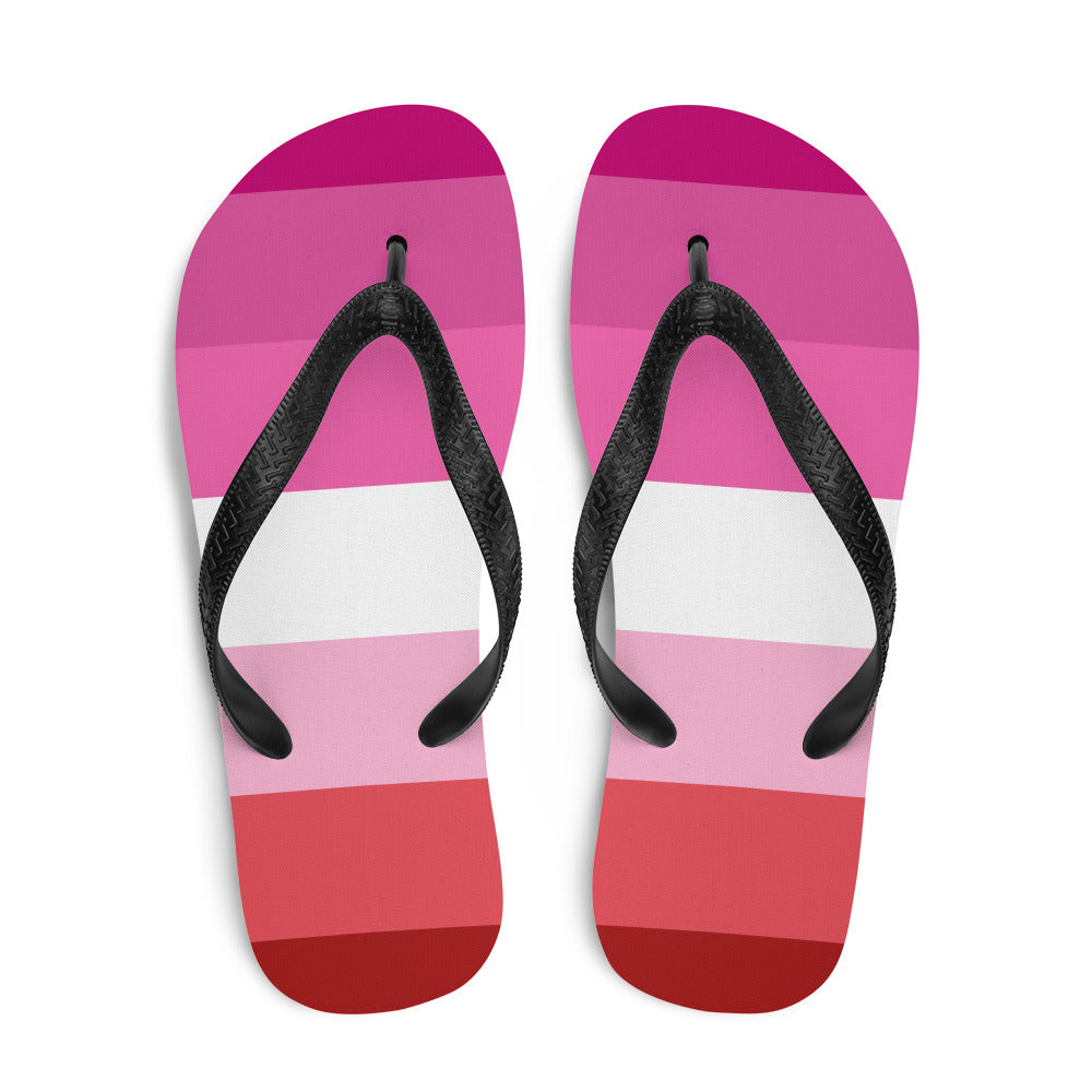 Lesbian pride flip-flops with pink, white, and red horizontal stripes and black straps