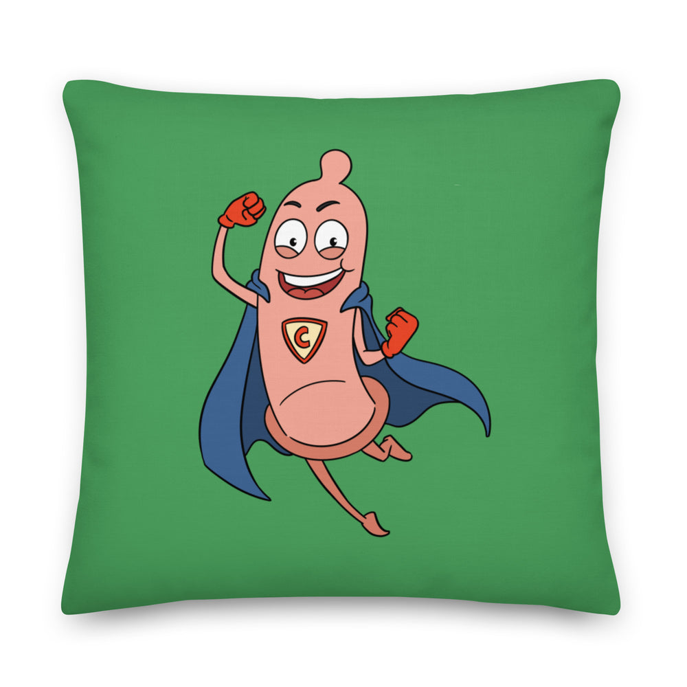 Square green pillow featuring a smiling cartoon condom superhero with a blue cape