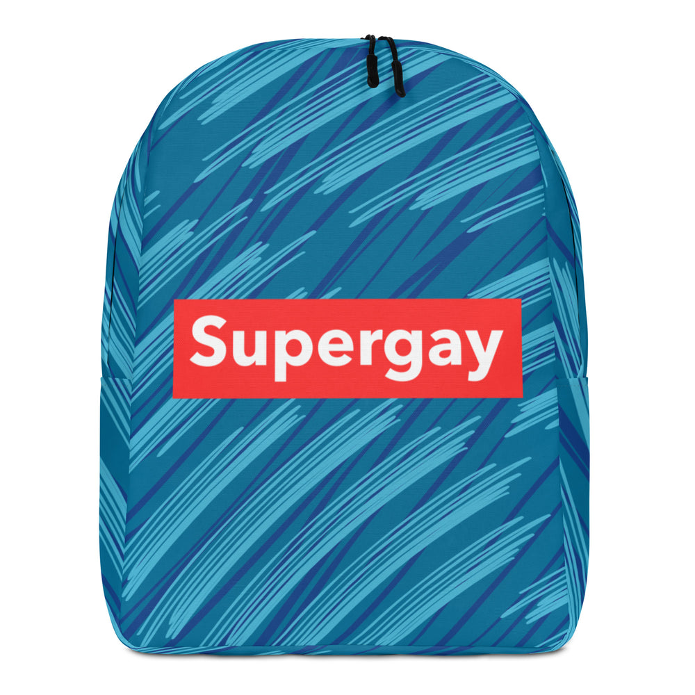 Front view of a blue patterned backpack with a red patch reading “Supergay”