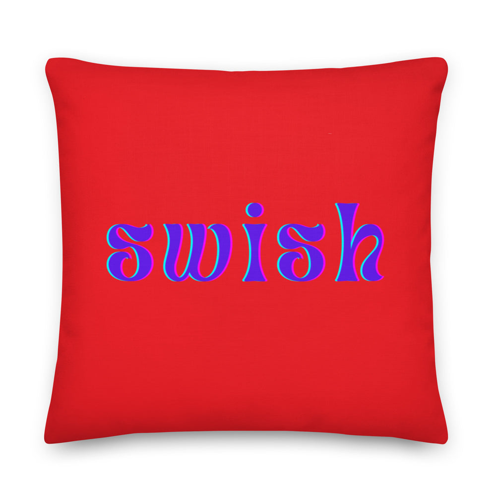 Front-facing red square pillow with purple and cyan lettering reading “swish”