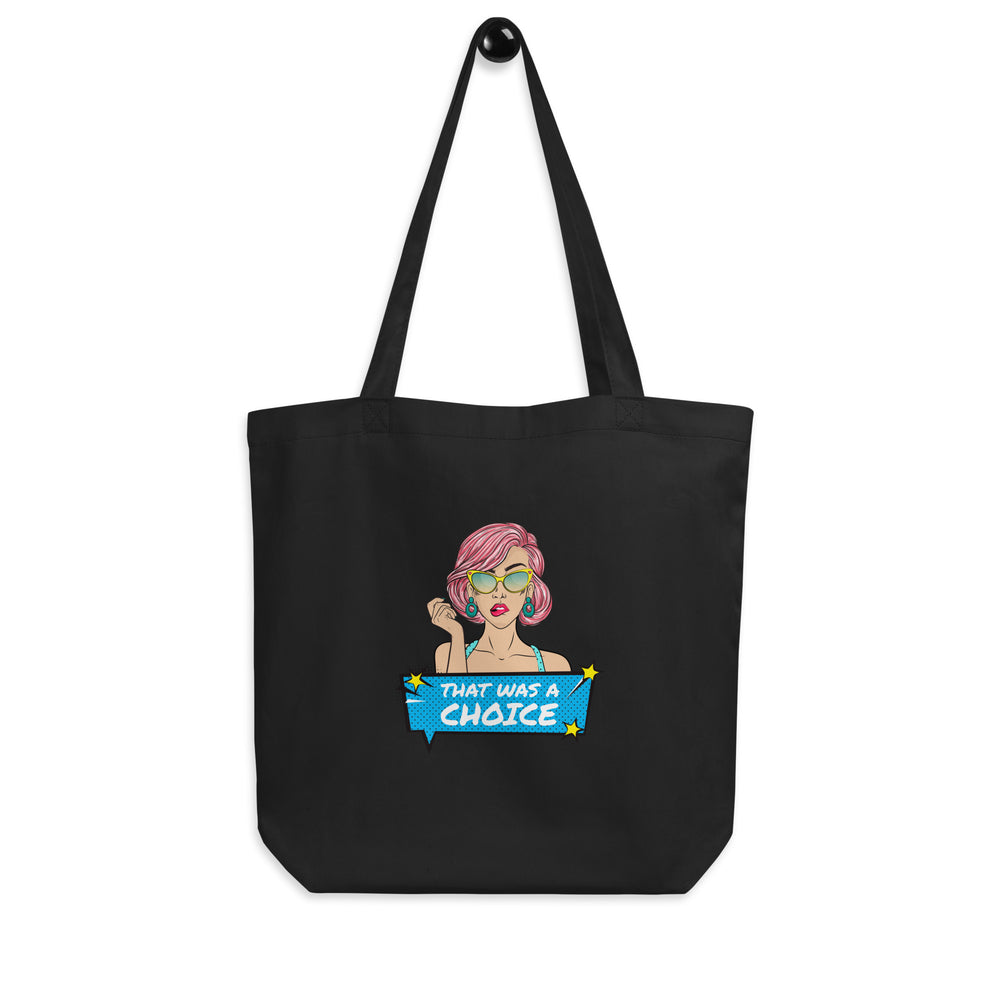 Front view of a black tote bag with a pink-haired cartoon woman and “THAT WAS A CHOICE” text