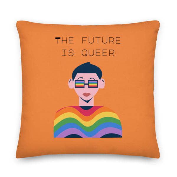 Orange square pillow reading “THE FUTURE IS QUEER,” with a rainbow illustration