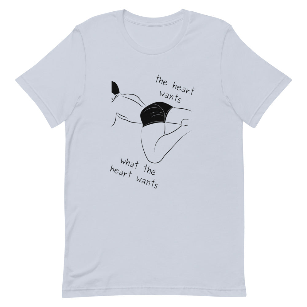 Light blue T-shirt with black line art and the words “the heart wants what the heart wants”