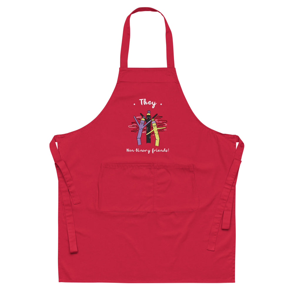 Front view of a red apron with “They” and “Non-binary friends!” text and cartoon figures