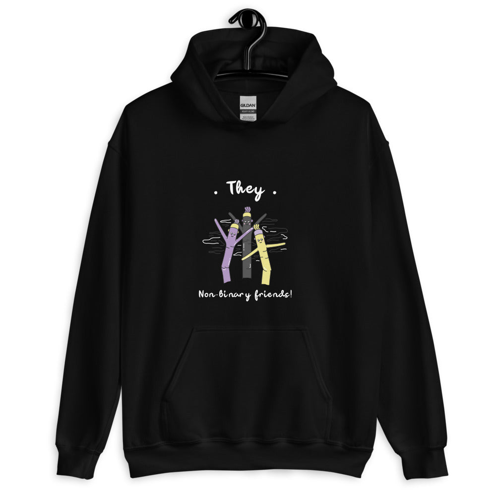 Black hoodie on a hanger reading “They” and “Non-binary friends!” above colorful figures