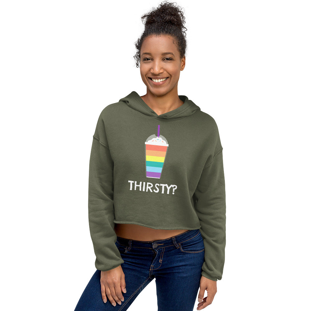 Model wearing a military green cropped hoodie with a rainbow drink graphic and “THIRSTY?” text
