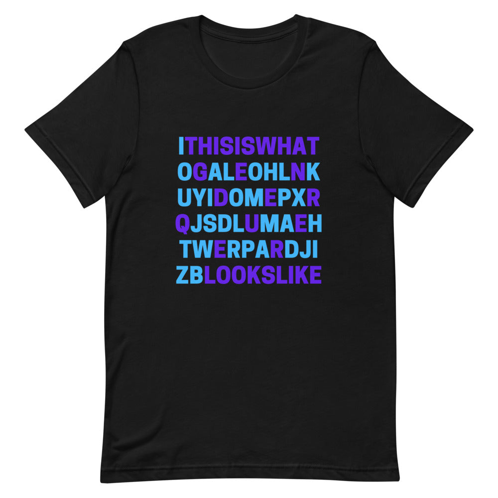 Black T-shirt with colorful block letters forming a scrambled text design on the front