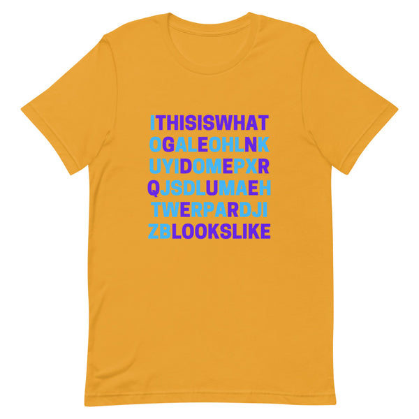 Orange genderqueer T-shirt with blue and purple text reading “This is what genderqueer looks like”
