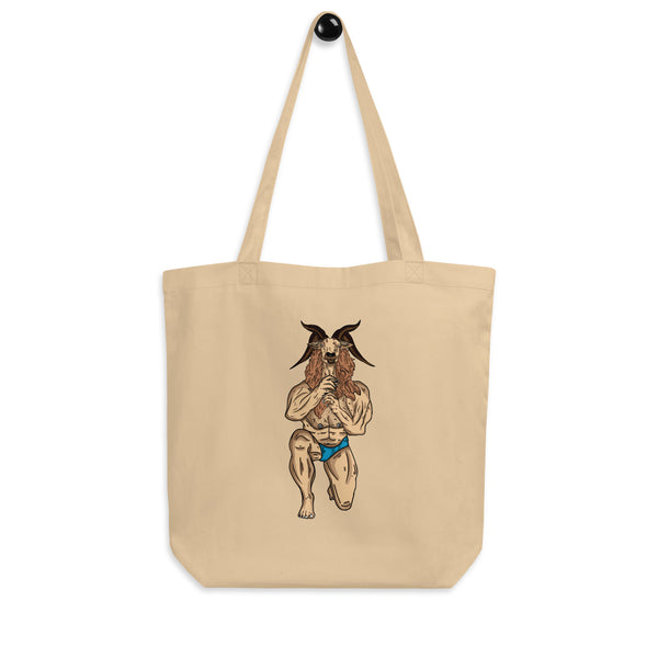 Natural canvas tote with long handles and a horned, goat-headed figure in blue briefs