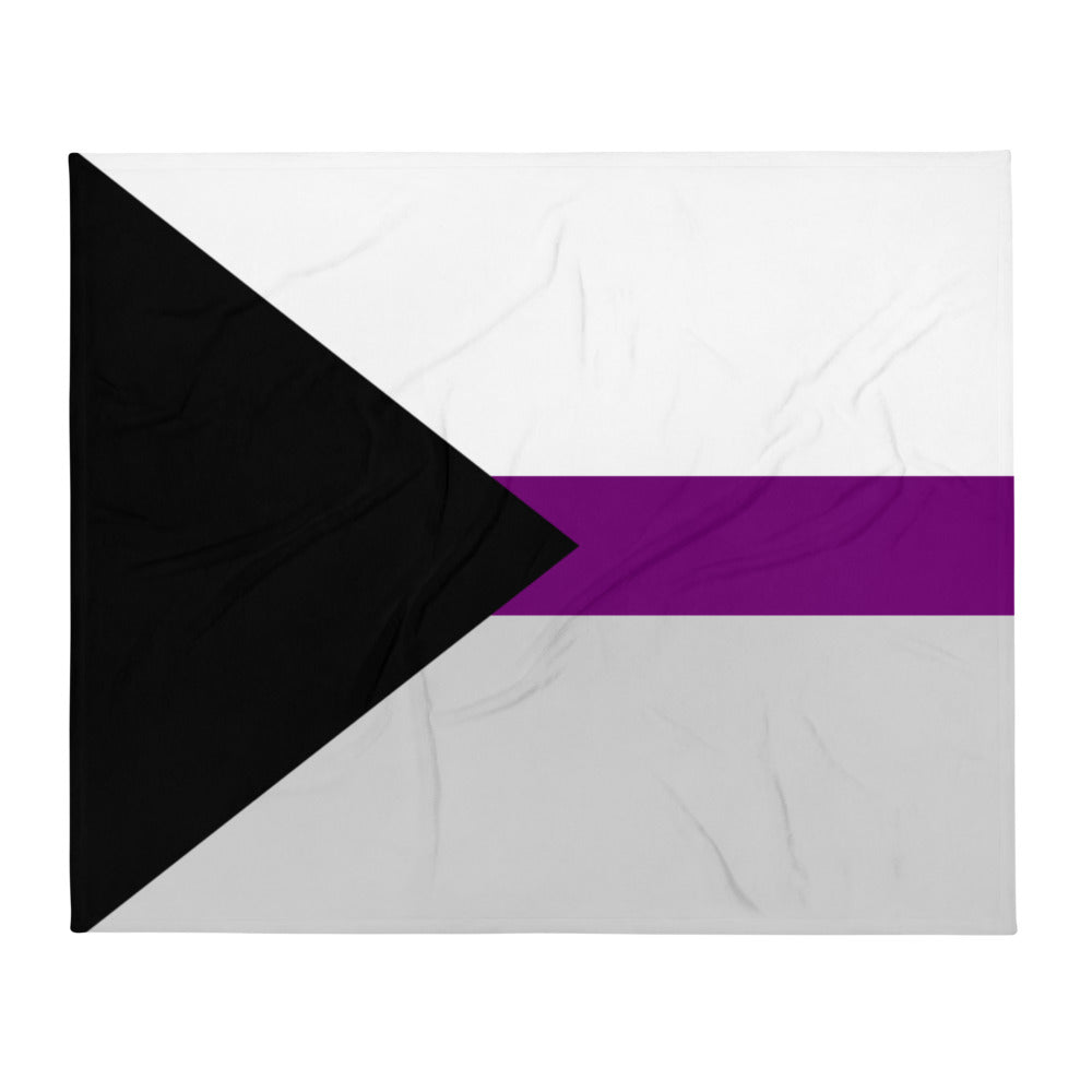 Demisexual Flag Throw Blanket with bold black, gray, white, and purple stripes draped on a black armchair in a chic living room.