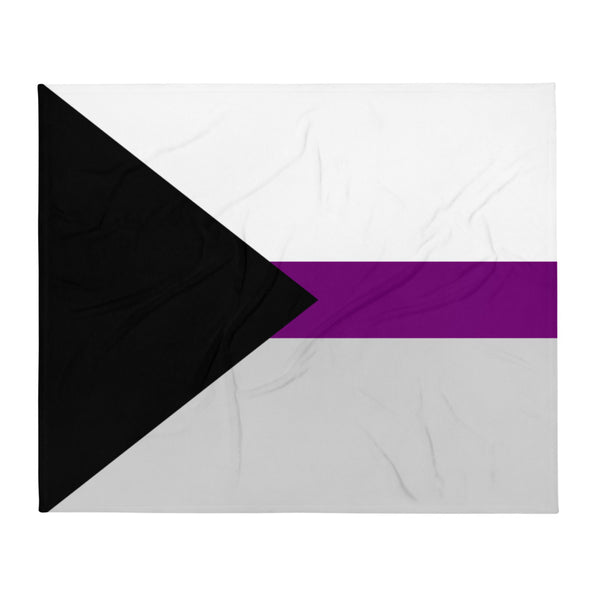 Demisexual Flag Throw Blanket with bold black, gray, white, and purple stripes draped on a black armchair in a chic living room.