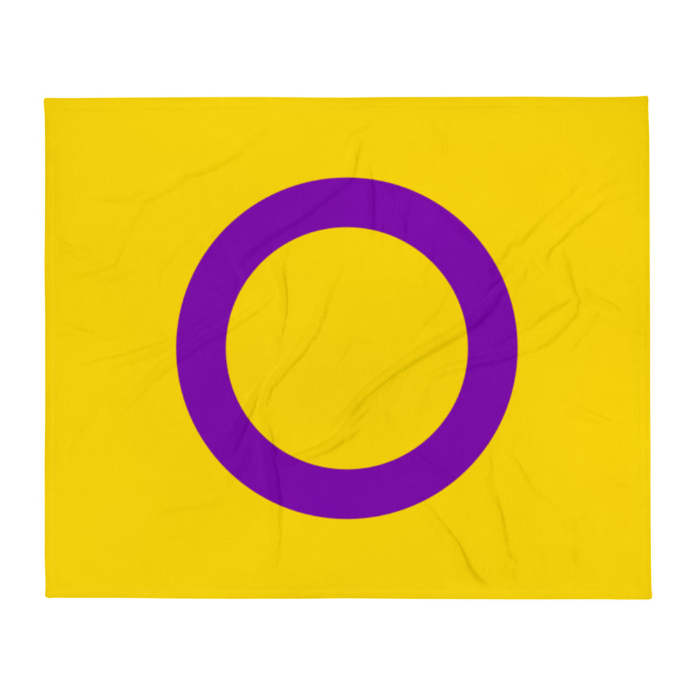 Front-facing yellow throw blanket with a large purple ring symbol