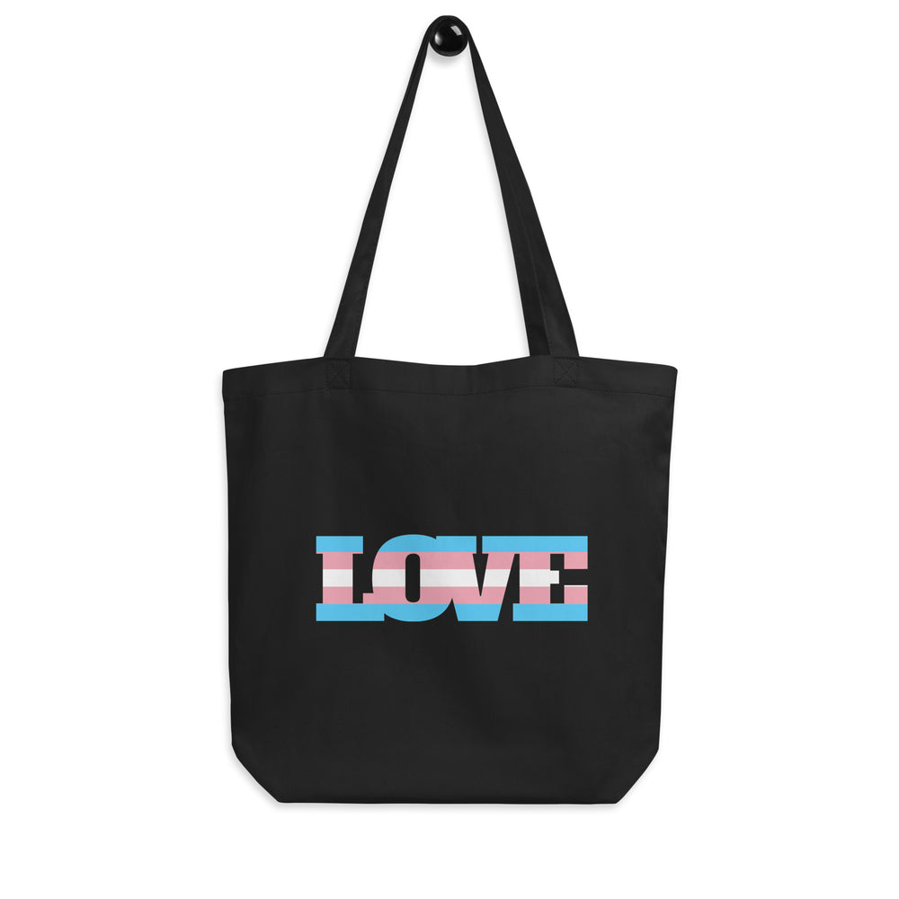 Black tote bag, front-facing product photo; trans Pride tote bag with “Transgender Love Eco” design
