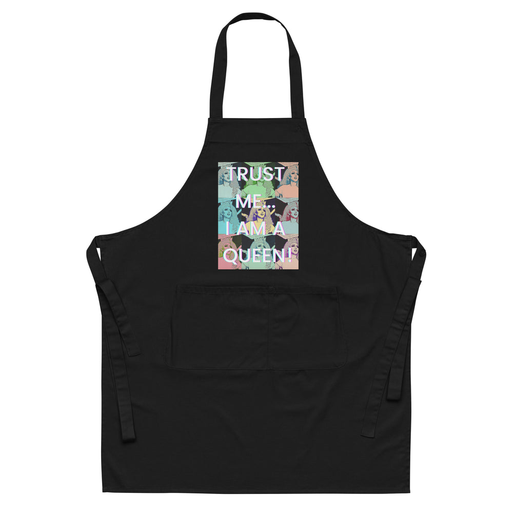 Front view of a black apron with a colorful queen collage and “TRUST ME... I AM A QUEEN!”