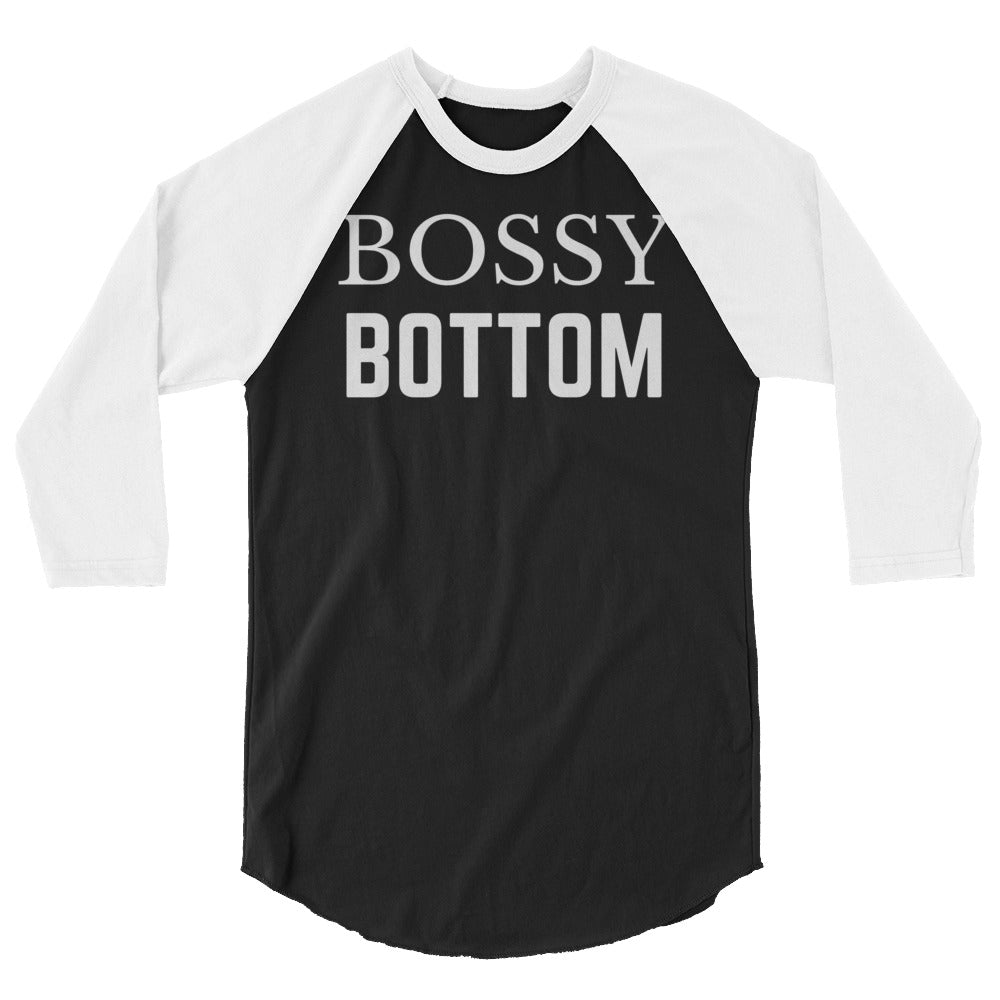 Front view of a black-and-white raglan shirt reading “BOSSY BOTTOM”
