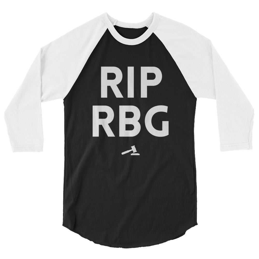 Front-facing black-and-white raglan shirt reading “RIP RBG” with a gavel graphic