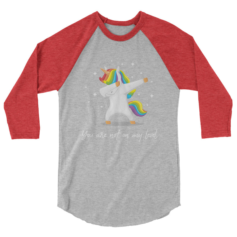 Gray and red raglan shirt with a rainbow-maned unicorn doing a dab and text, “You are not on my level.”