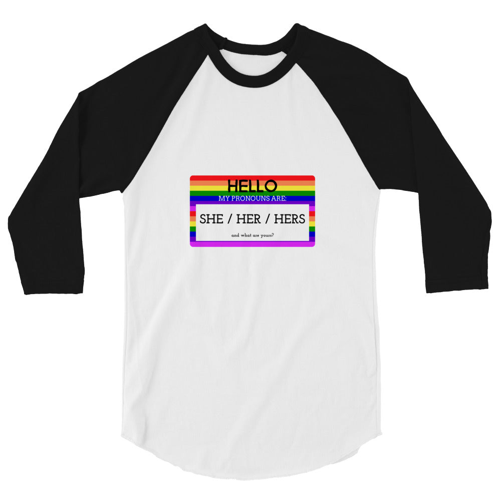 Front-facing white raglan shirt with black three-quarter sleeves and a rainbow pronoun badge