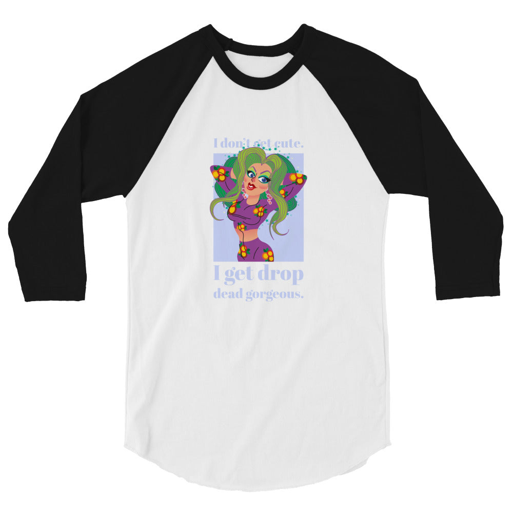 Front view of a white-and-black raglan shirt with a colorful drag-style woman and text, “I get drop dead gorgeous.”