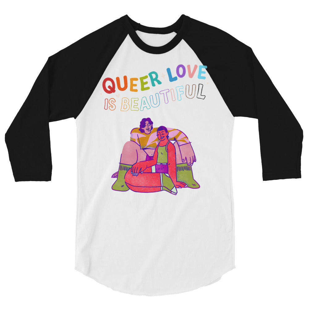 Front view of a white-and-black raglan shirt reading “QUEER LOVE IS BEAUTIFUL” above a colorful couple illustration