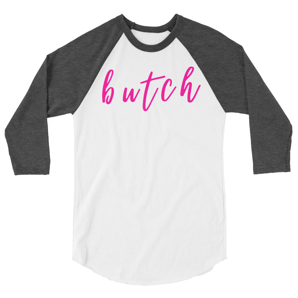 Front view of a white raglan shirt with dark gray three-quarter sleeves and pink “butch” lettering