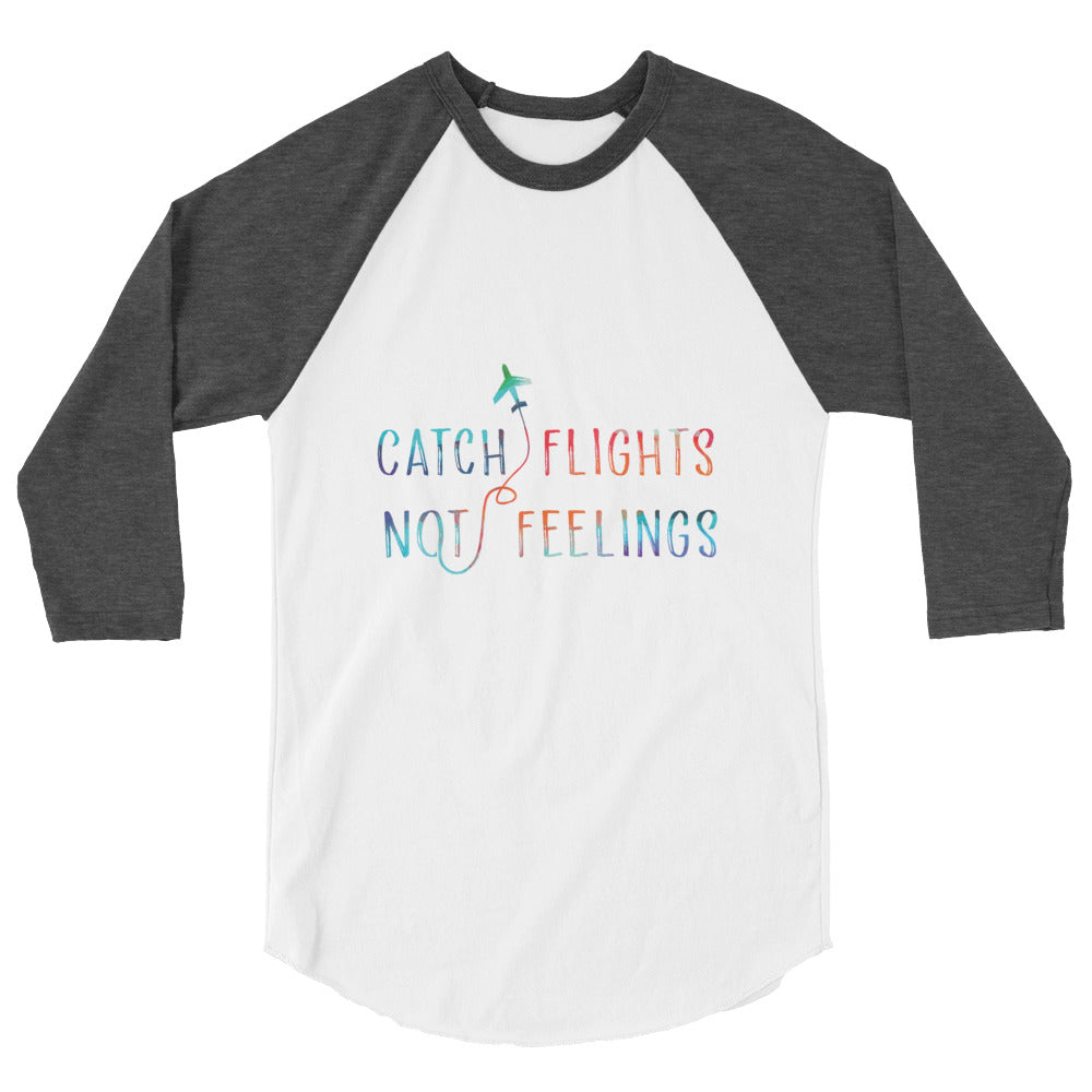 Flat-lay white and charcoal raglan shirt reading “CATCH FLIGHTS NOT FEELINGS”