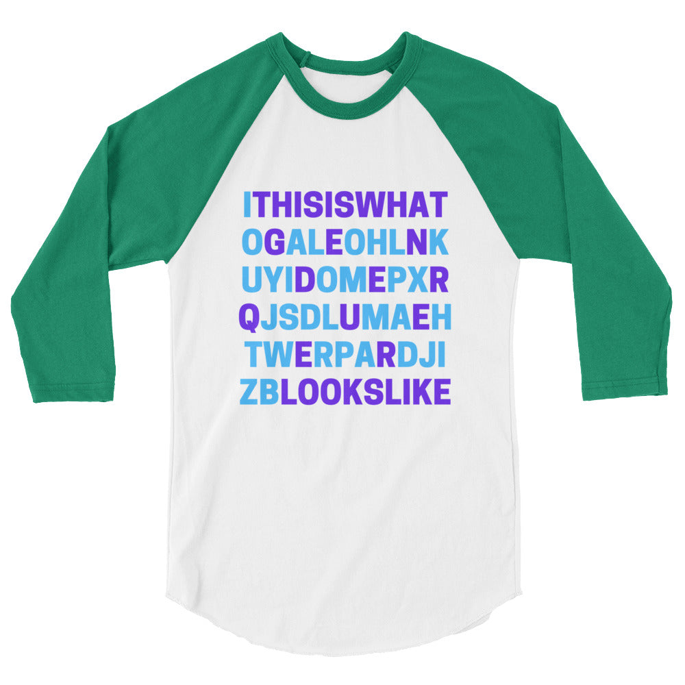 Green and white raglan shirt printed with “THIS IS WHAT GENDERQUEER LOOKS LIKE”