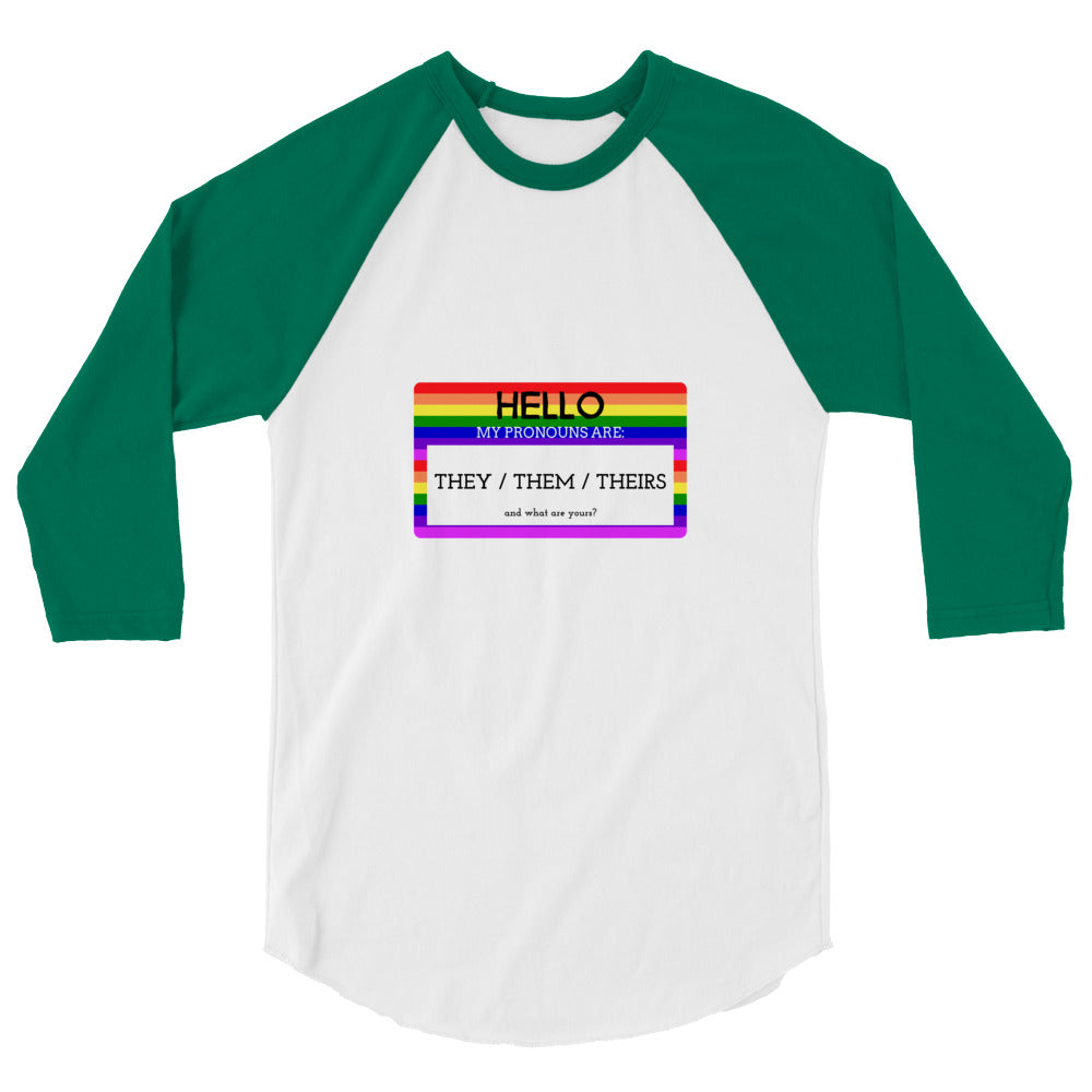 Front view of a white and green raglan shirt reading “Hello, my pronouns are: They / Them / Theirs.”