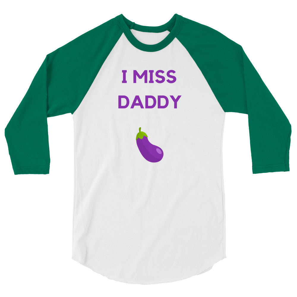 Front view of a white raglan shirt with green sleeves reading “I MISS DADDY” above an eggplant graphic