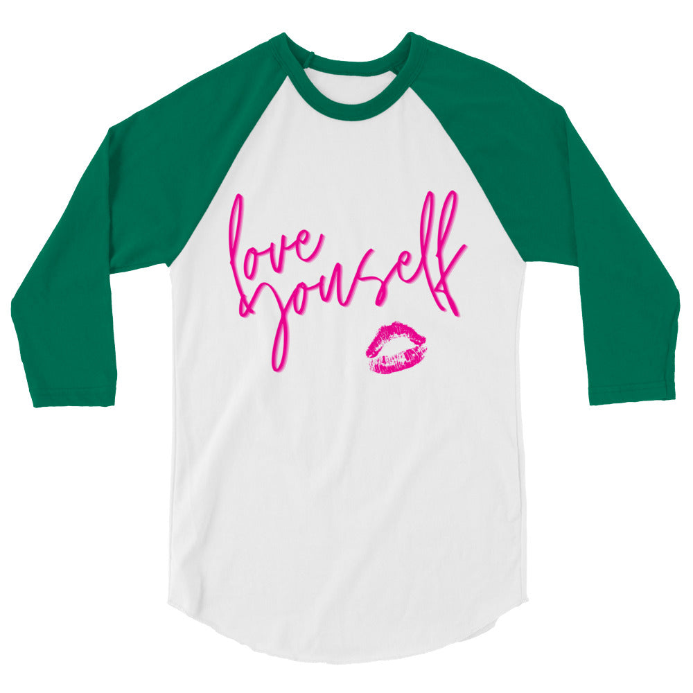 Front view of a white and green raglan shirt reading “love yourself” with pink lips