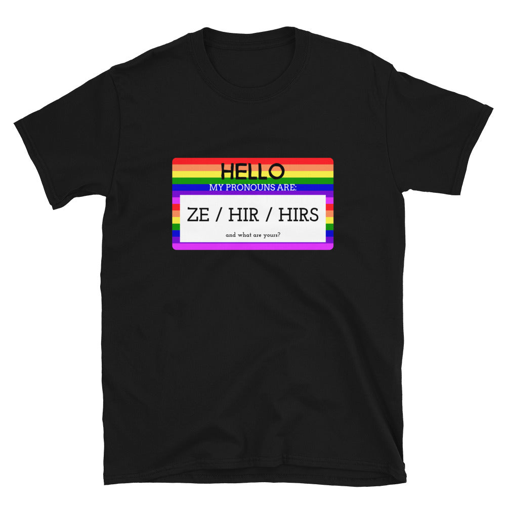 Black T-shirt with a rainbow pronoun badge reading “Hello, my pronouns are: Ze / Hir / Hirs”
