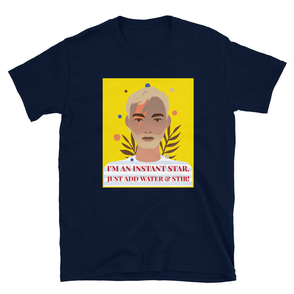 Navy T-shirt with illustrated face and the slogan “I'M AN INSTANT STAR. JUST ADD WATER & STIR!”