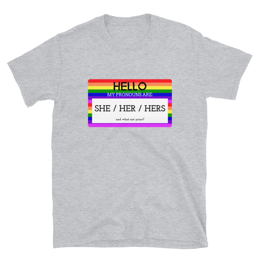 Gray T-shirt with rainbow-bordered pronoun graphic reading “HELLO MY PRONOUNS ARE: SHE / HER / HERS”