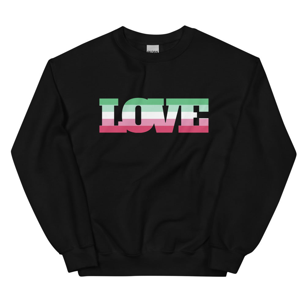 Black crewneck sweatshirt with large LOVE lettering in green, white, pink, and black