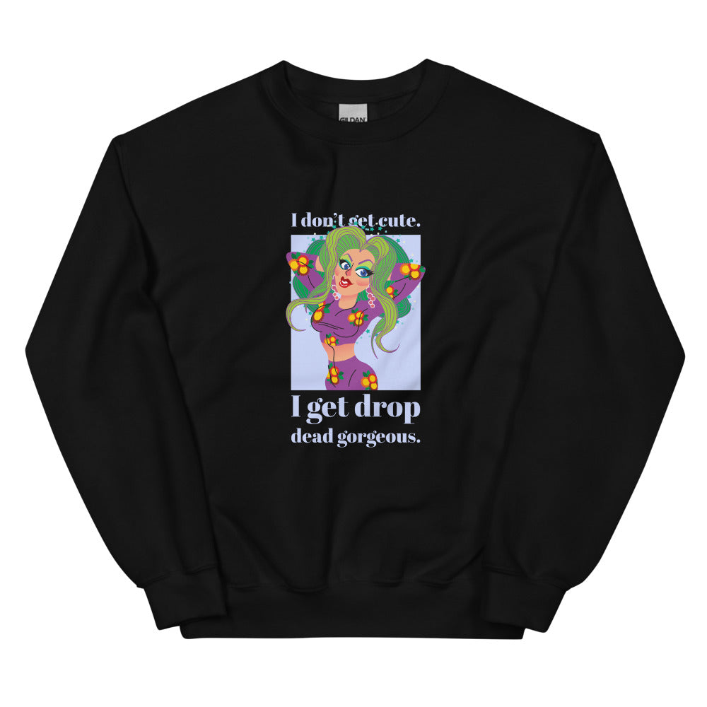 Front view of a black sweatshirt with a colorful drag-style figure and “I don’t get cute. I get drop dead gorgeous.”