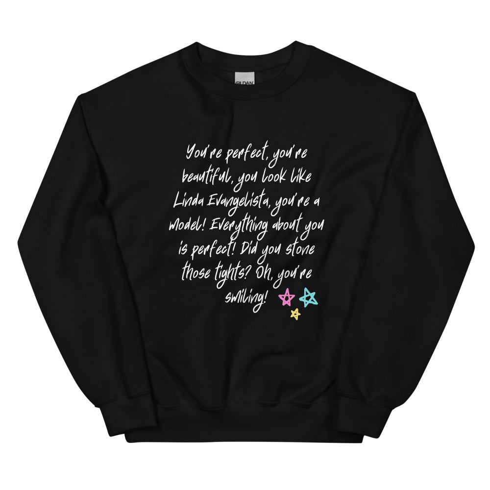 Black sweatshirt with white script quote mentioning Linda Evangelista and colorful stars