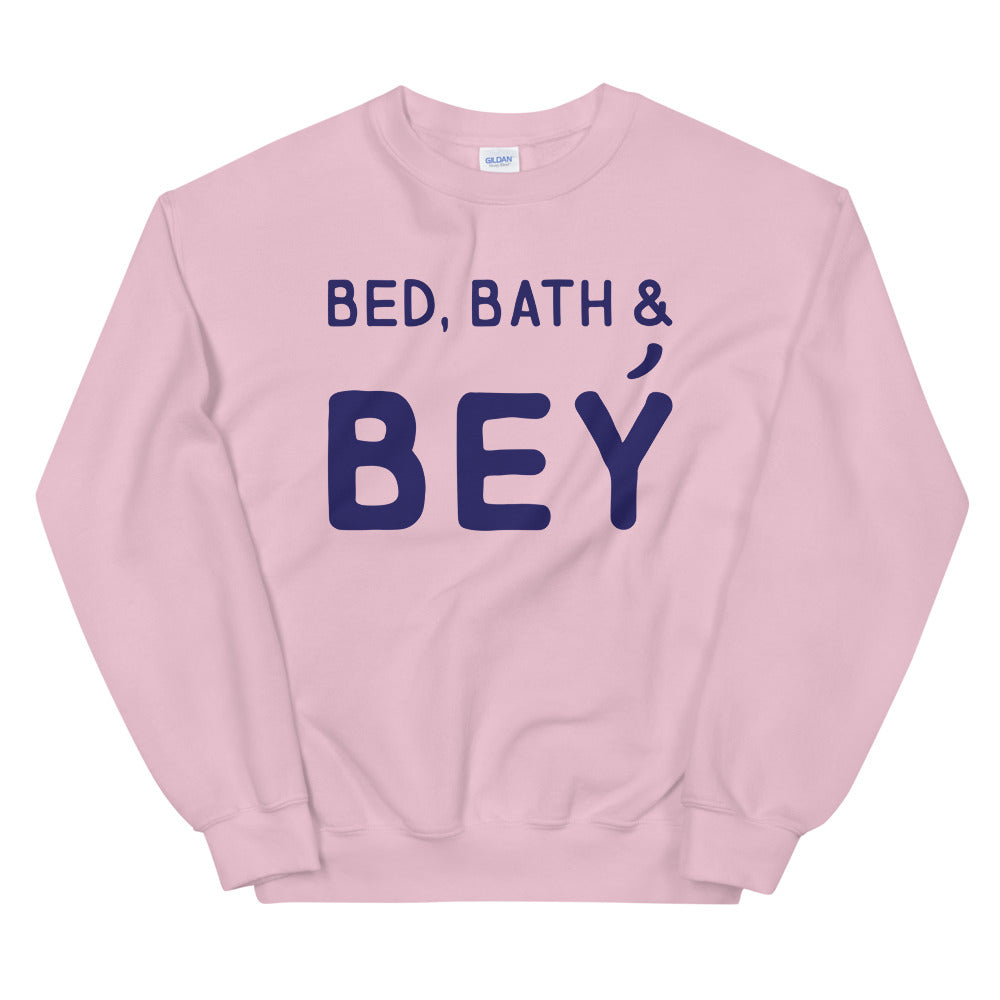 Pink crewneck sweatshirt with navy “BED, BATH & BEY” lettering