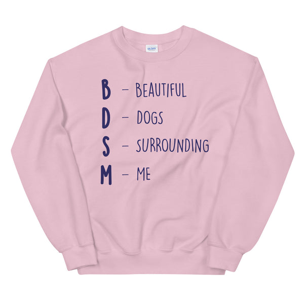 Pink sweatshirt reading “BDSM – Beautiful Dogs Surrounding Me” in navy lettering