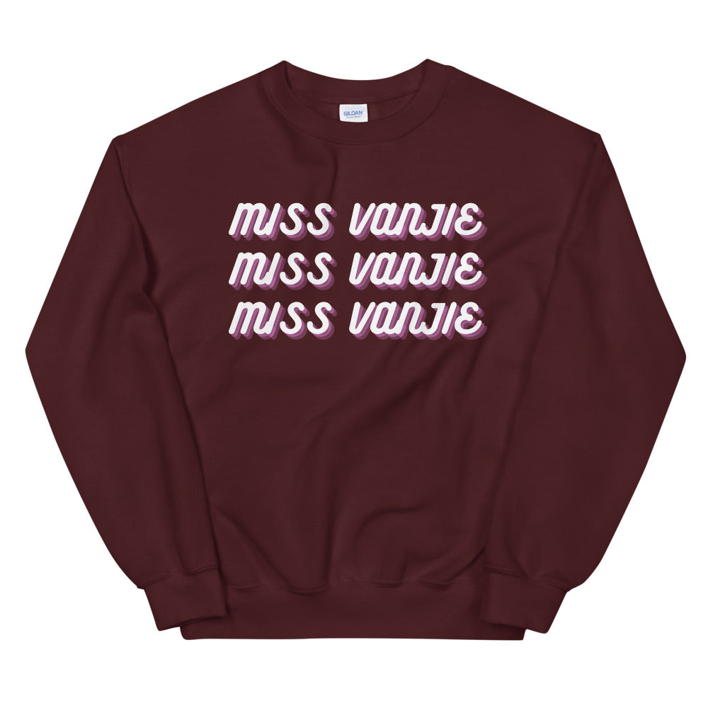 Maroon sweatshirt with three repeated white and pink “MISS VANJIE” chest prints