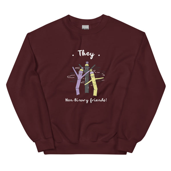 Maroon sweatshirt with “They” above three colorful figures and “Non-binary friends!” below