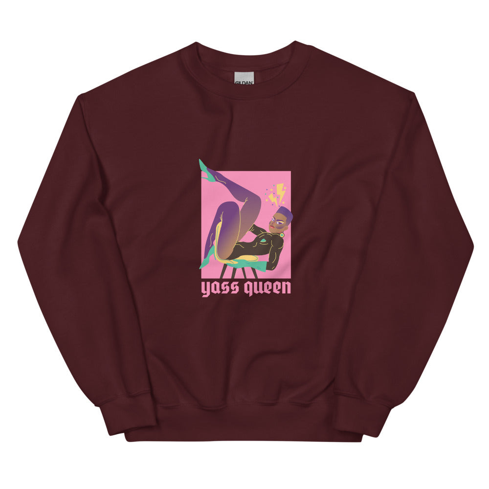 Front-facing maroon sweatshirt with a colorful seated figure and “Yass Queen” text
