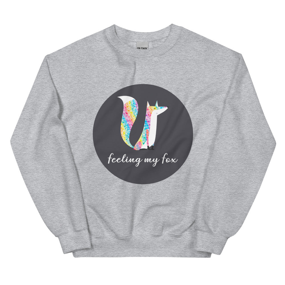 Flat-lay gray sweatshirt with a colorful fox graphic and “feeling my fox” text
