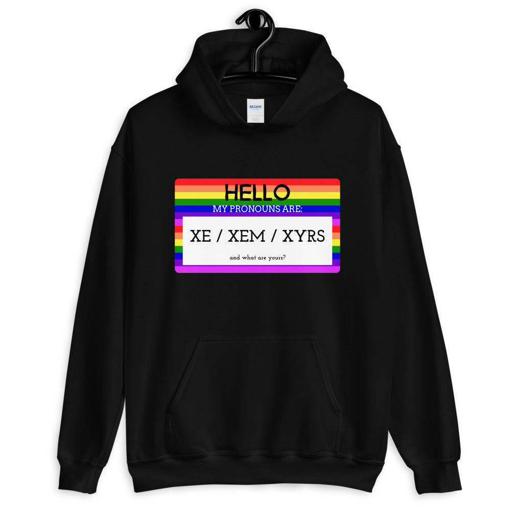 Black hoodie with rainbow-striped pronoun graphic reading “HELLO” and “XE / XEM / XYRS”