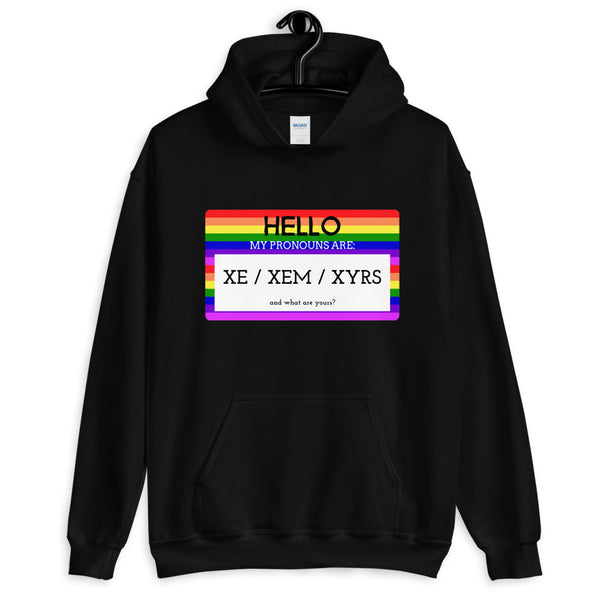 Black hoodie with rainbow-striped pronoun graphic reading “HELLO” and “XE / XEM / XYRS”