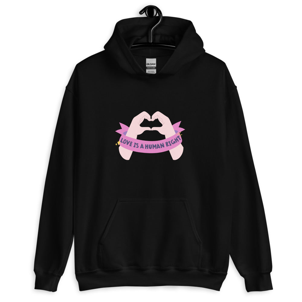 Front view of a black hoodie with pink hands forming a heart and “LOVE IS A HUMAN RIGHT”