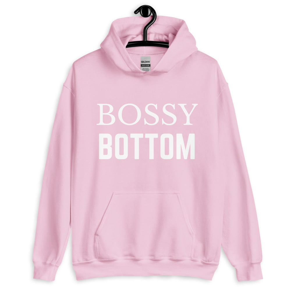 Front-facing light pink hoodie with white “BOSSY BOTTOM” lettering and a kangaroo pocket